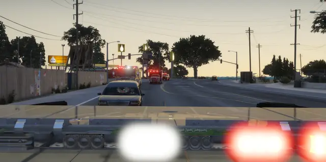 A patrol unit working traffic on a main road at dusk