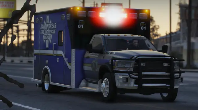An ambulance responding on a city street at night