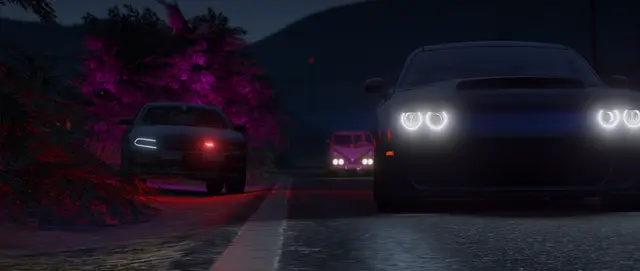 Vehicles facing the camera at night with headlights on