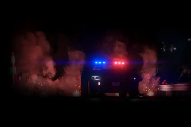 A patrol car lit by red smoke at a night scene