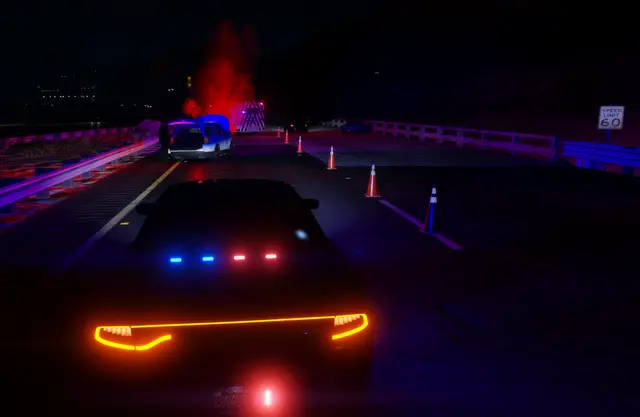 A patrol unit with an amber light bar on a highway at night