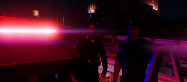 A person standing in the red glow of a road flare